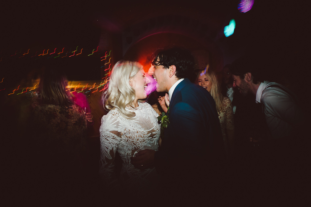bride and groom dancing together 