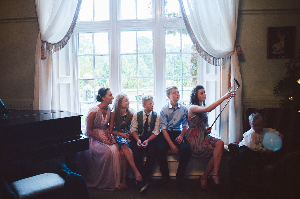 wedding guests taking a selfie. 