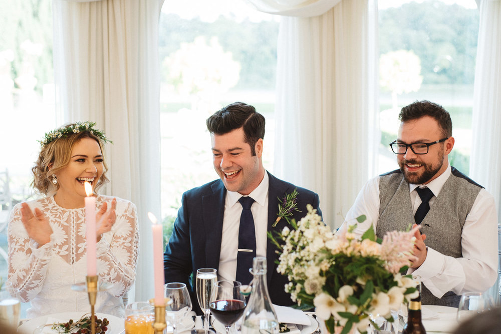 bride and groom laughing 