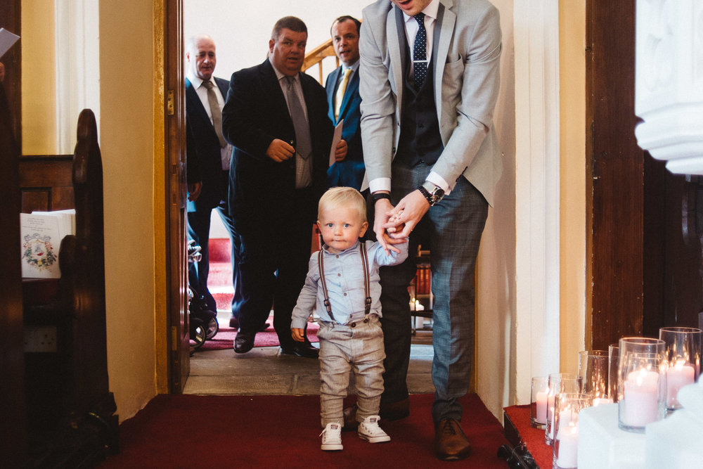 Little toddler dressed for a wedding 
