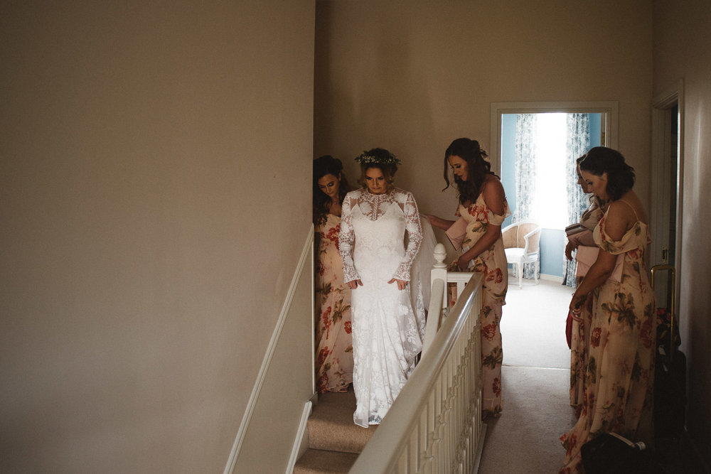 bride walking down stairs. Castle Leslie Wedding.