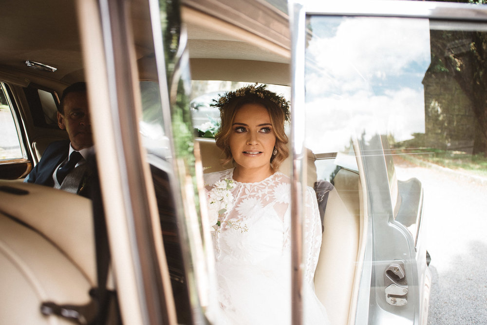 Beautiful bride in wedding car, Castle Leslie Wedding.