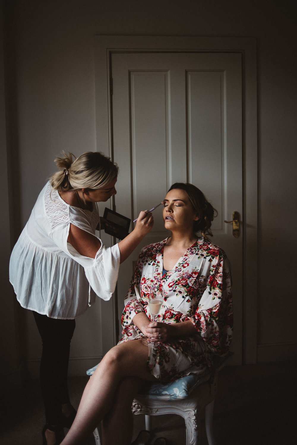 bride sitting for make up