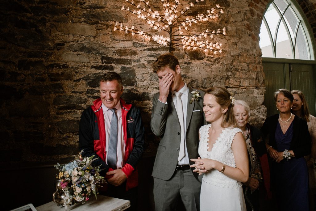 groom laughing at brother 