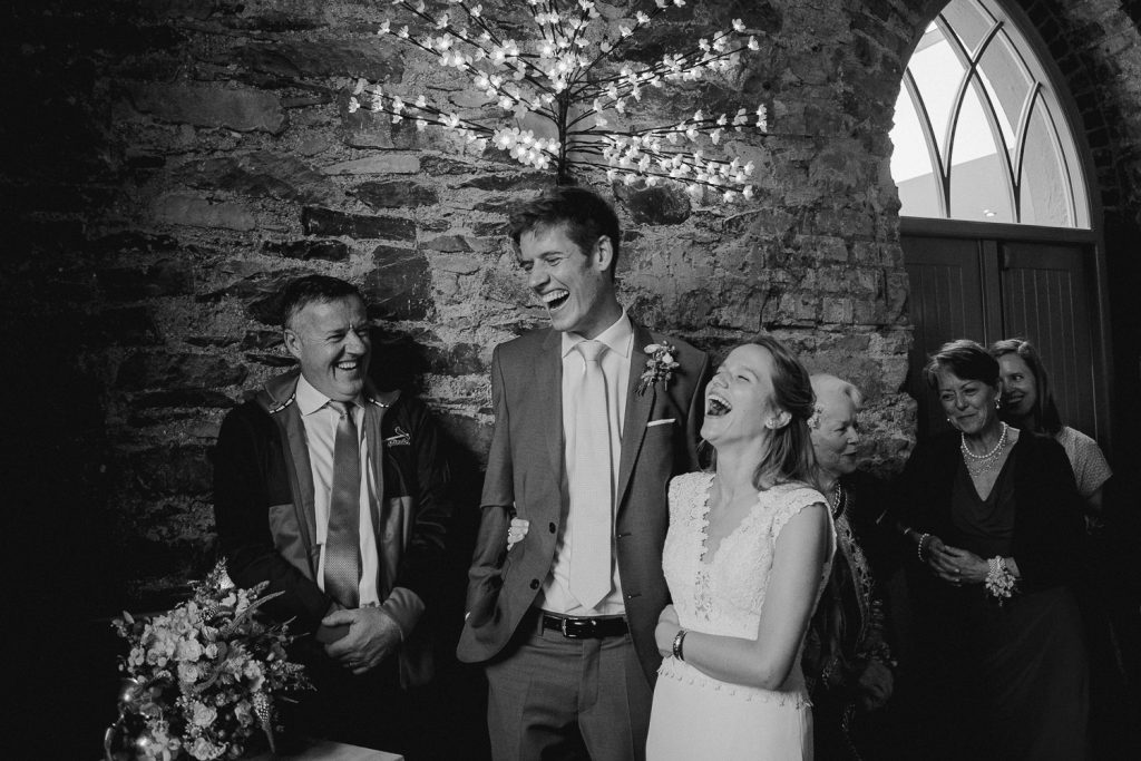 bride and groom laughing