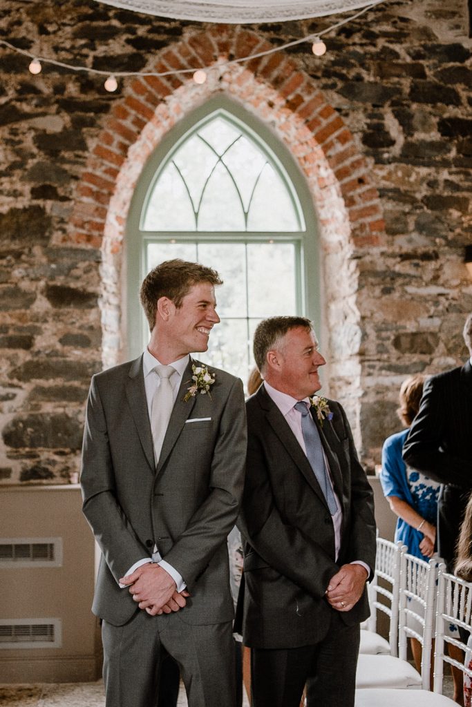 groom looks back to see the bride 