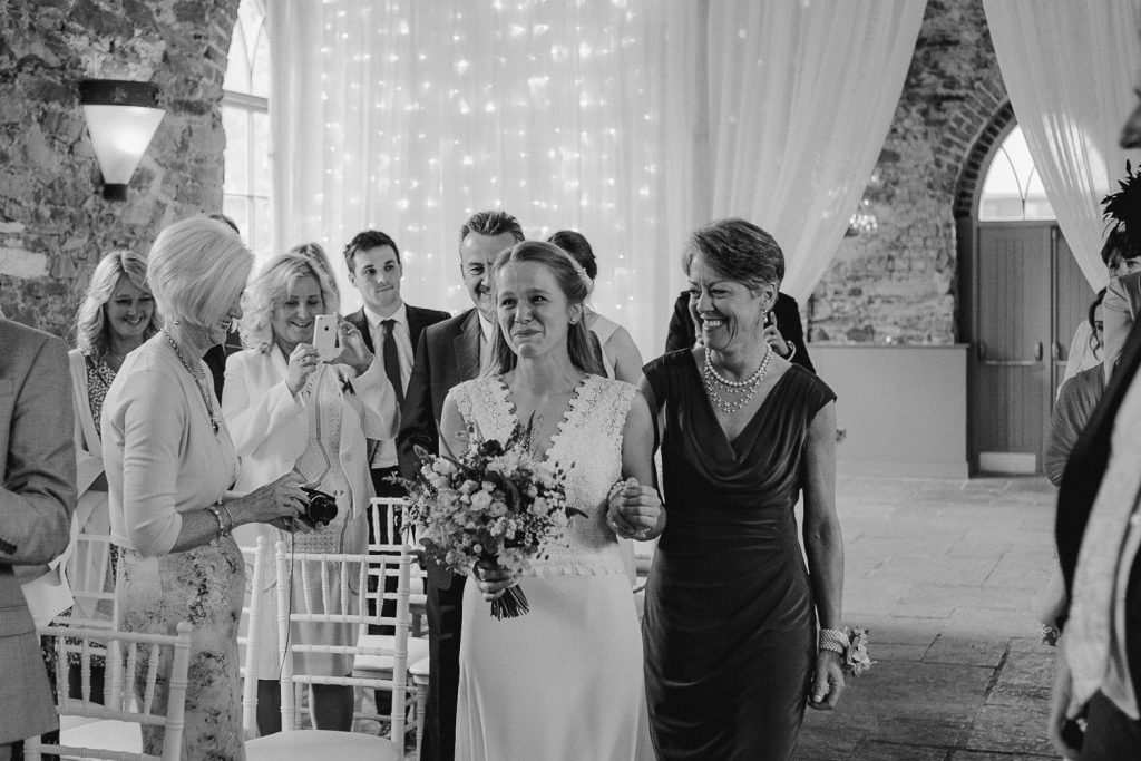 brides mother walks her up the aisle 