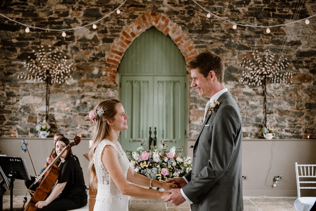 bride and groom make their vows 