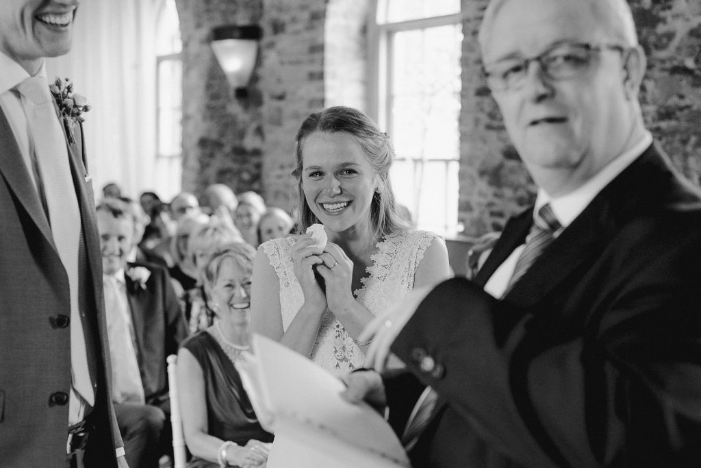 bride is smiling and crying 