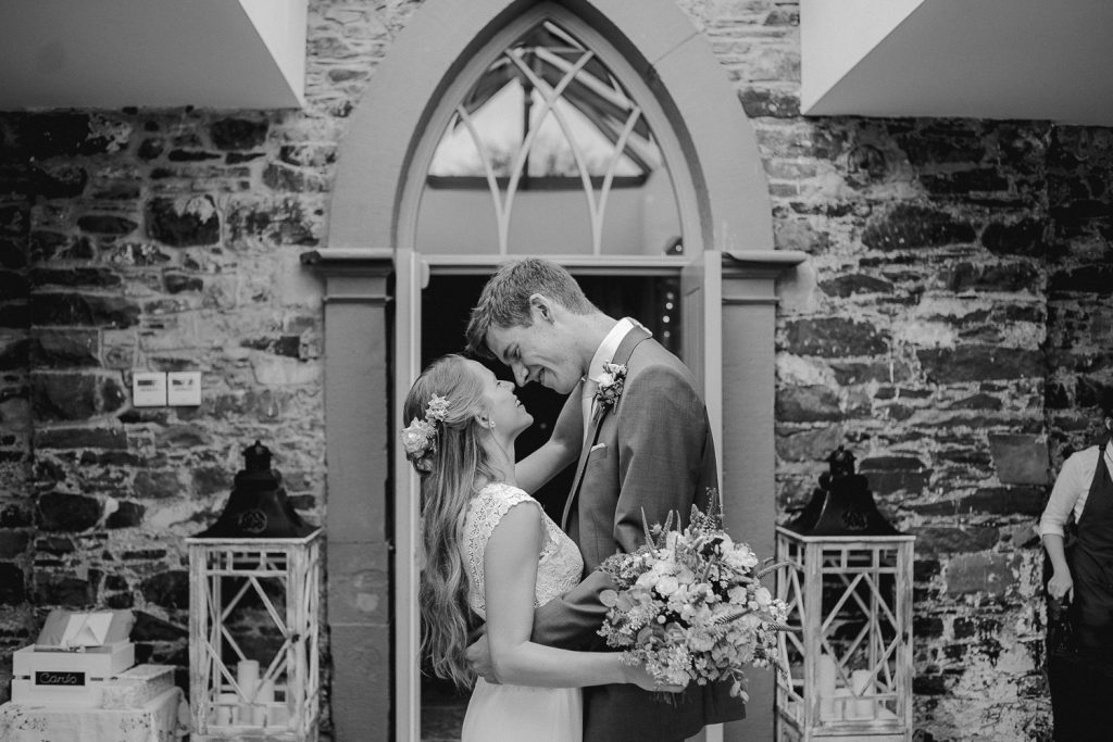 bride and groom stop for a kiss 
