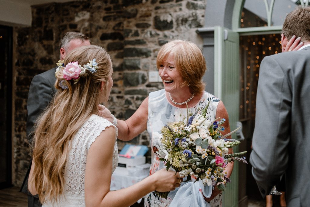 grooms mother congratulates the bride 