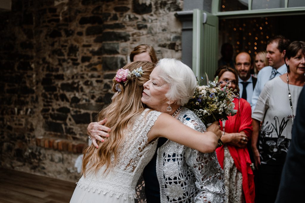 bride hugs her grandmother 