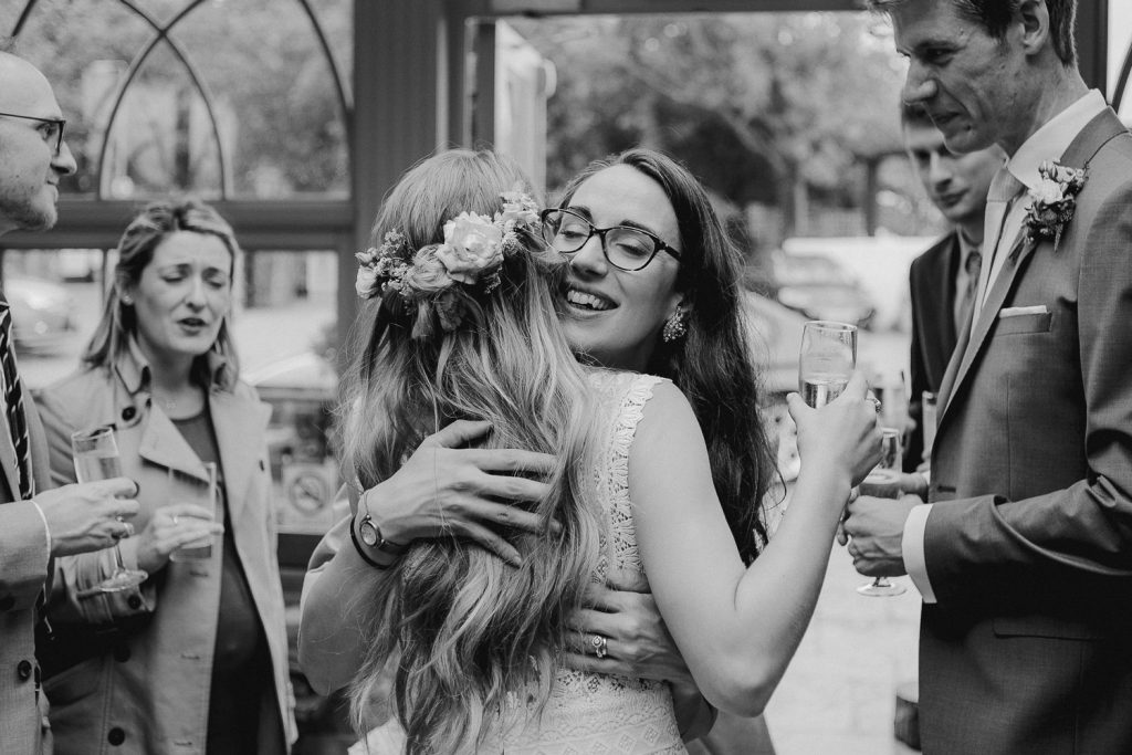 wedding guest hugs the bride 