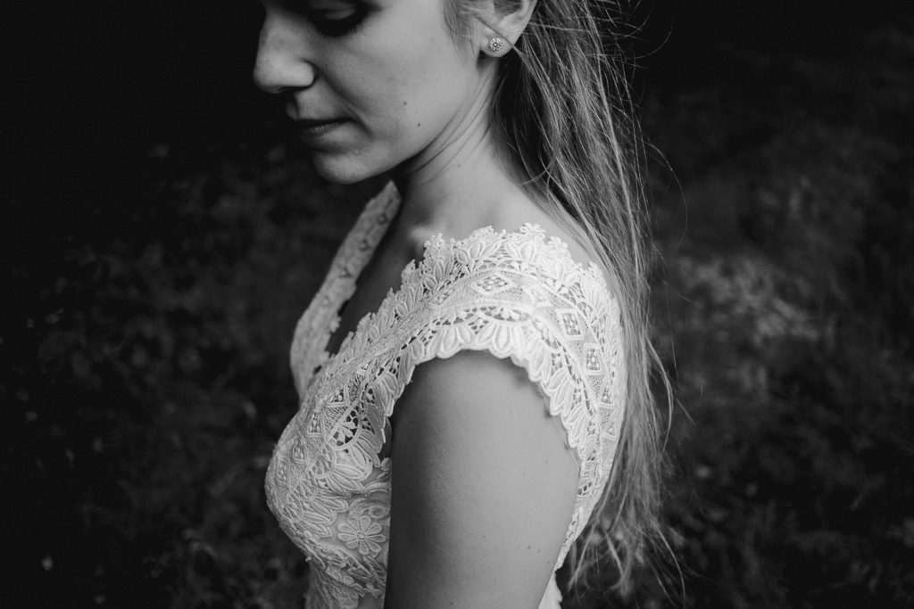 close up of brides lace dress 
