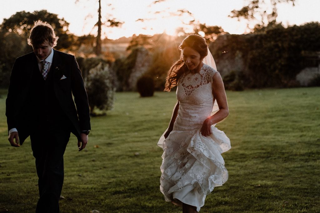 bride and groom running back in Gracehall wedding