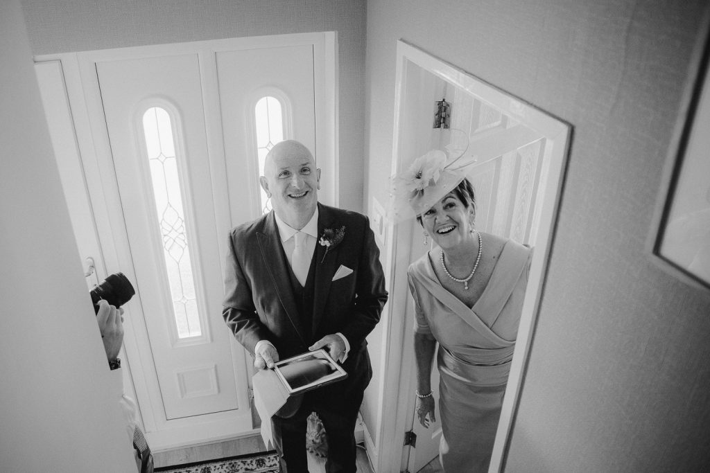 brides parents looking up stairs