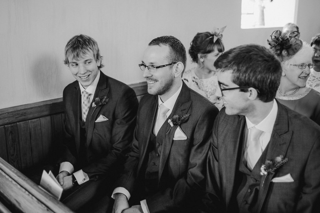 groom in church with friends