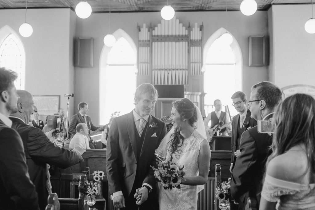 bride and groom walking down aisle