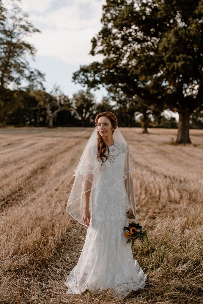 Gracehall wedding. Bride in wheat field