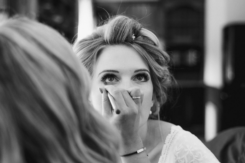 bride getting eye make up on