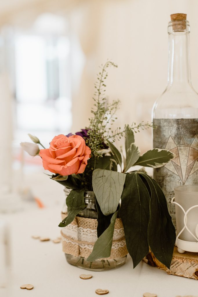 orange rose in a jar 