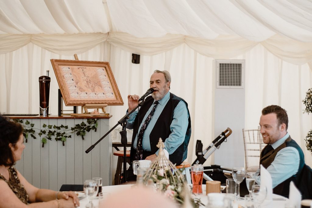 man in tie giving speech 