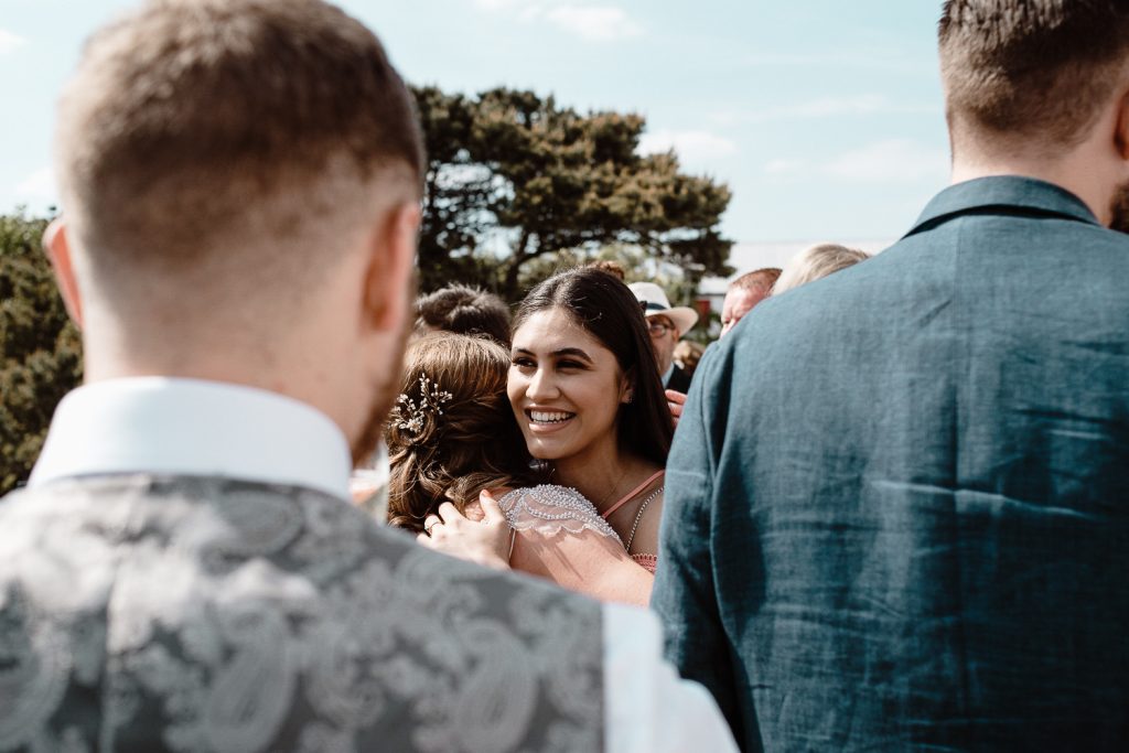 bride hugging guests 