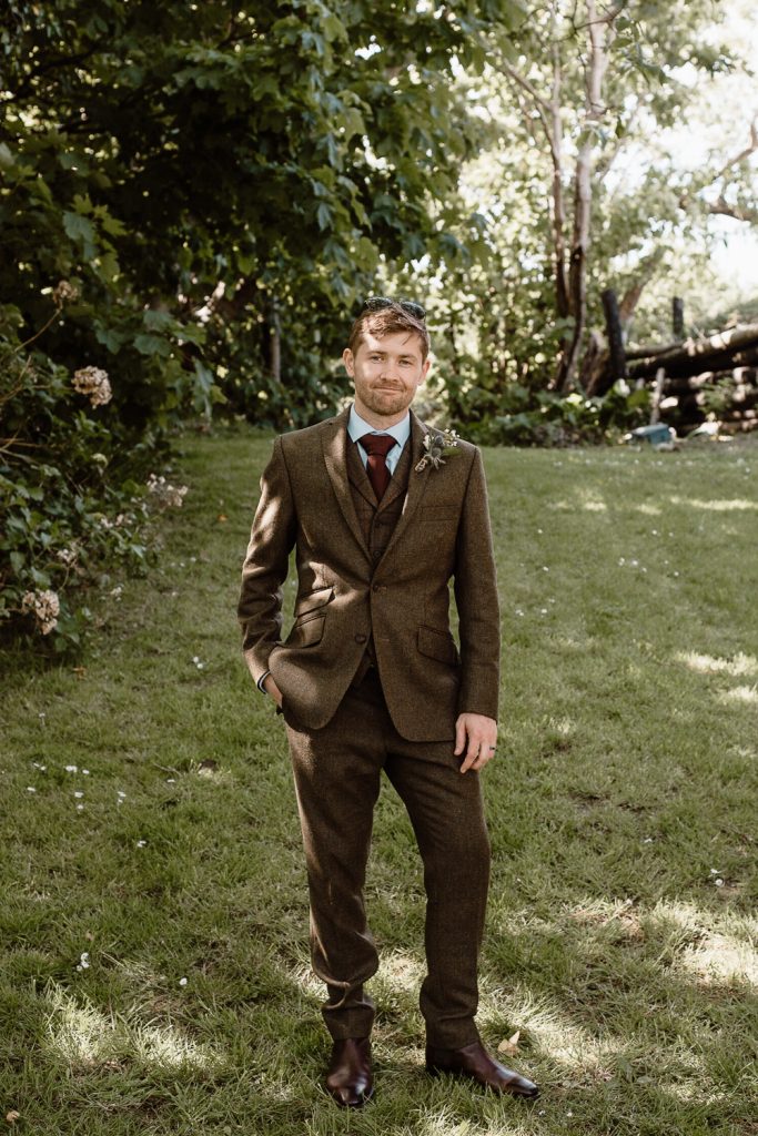 full length of groom standing 