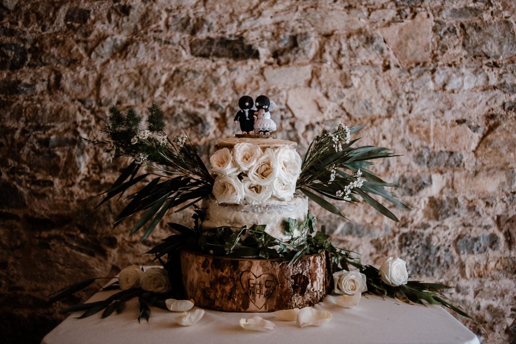 wedding cake on tree trunk