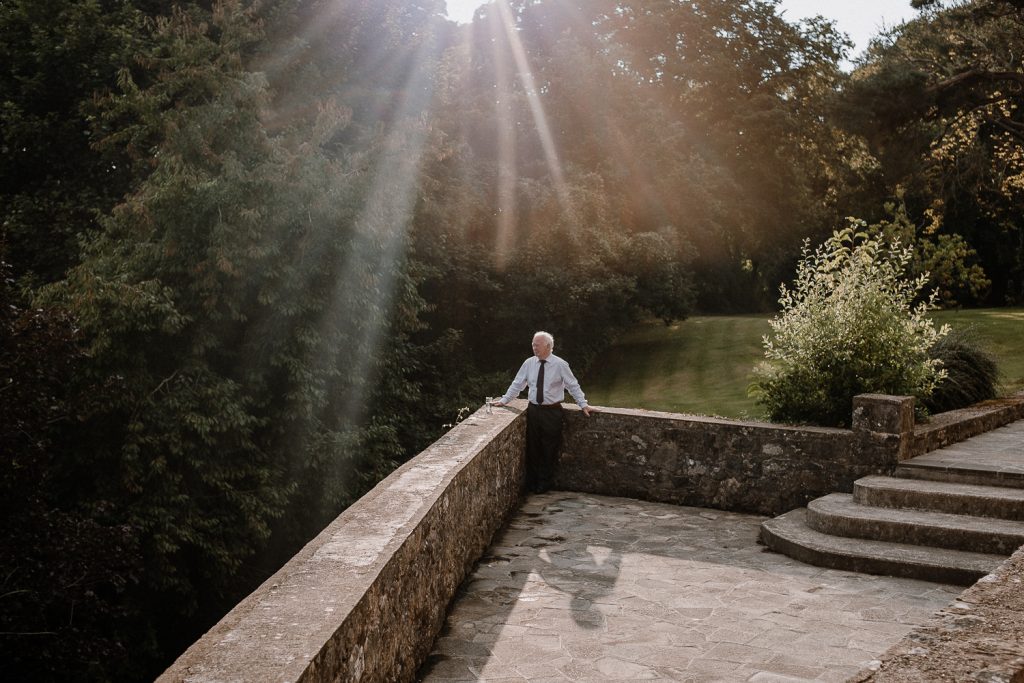 man standing in gorgeous sun rays