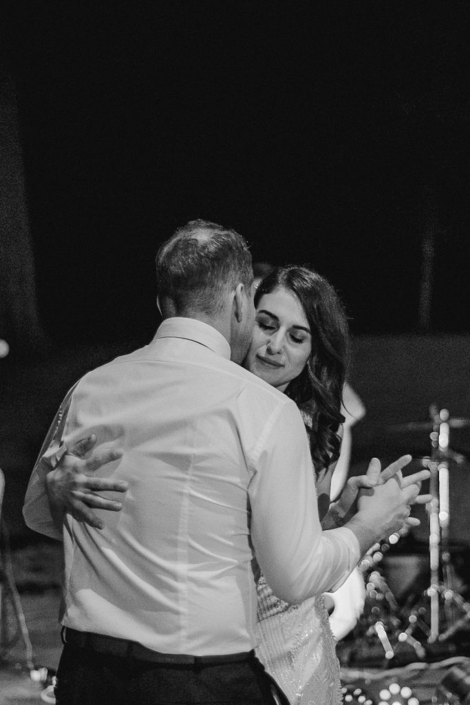 close up of bride dancing with eyes closed