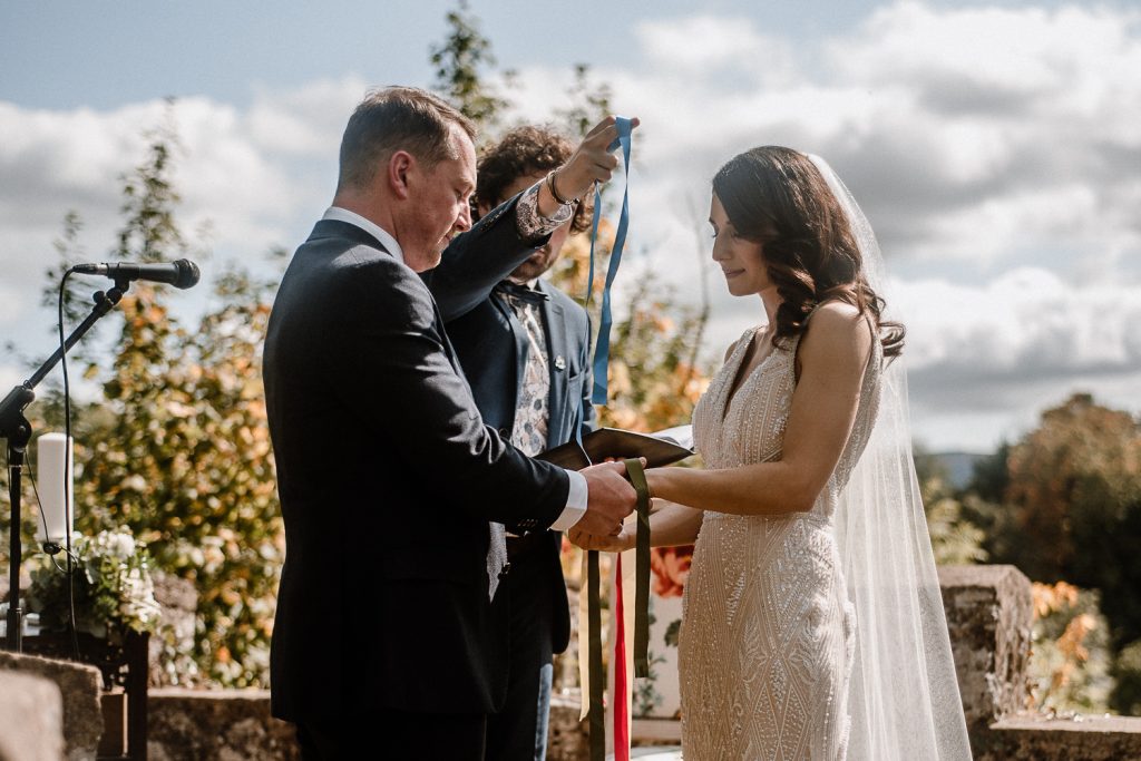 bride and groom do hand fasting