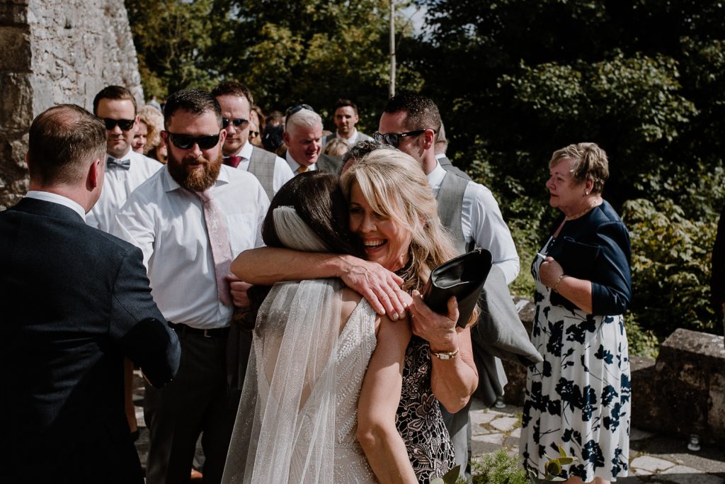 brides mum hugs her